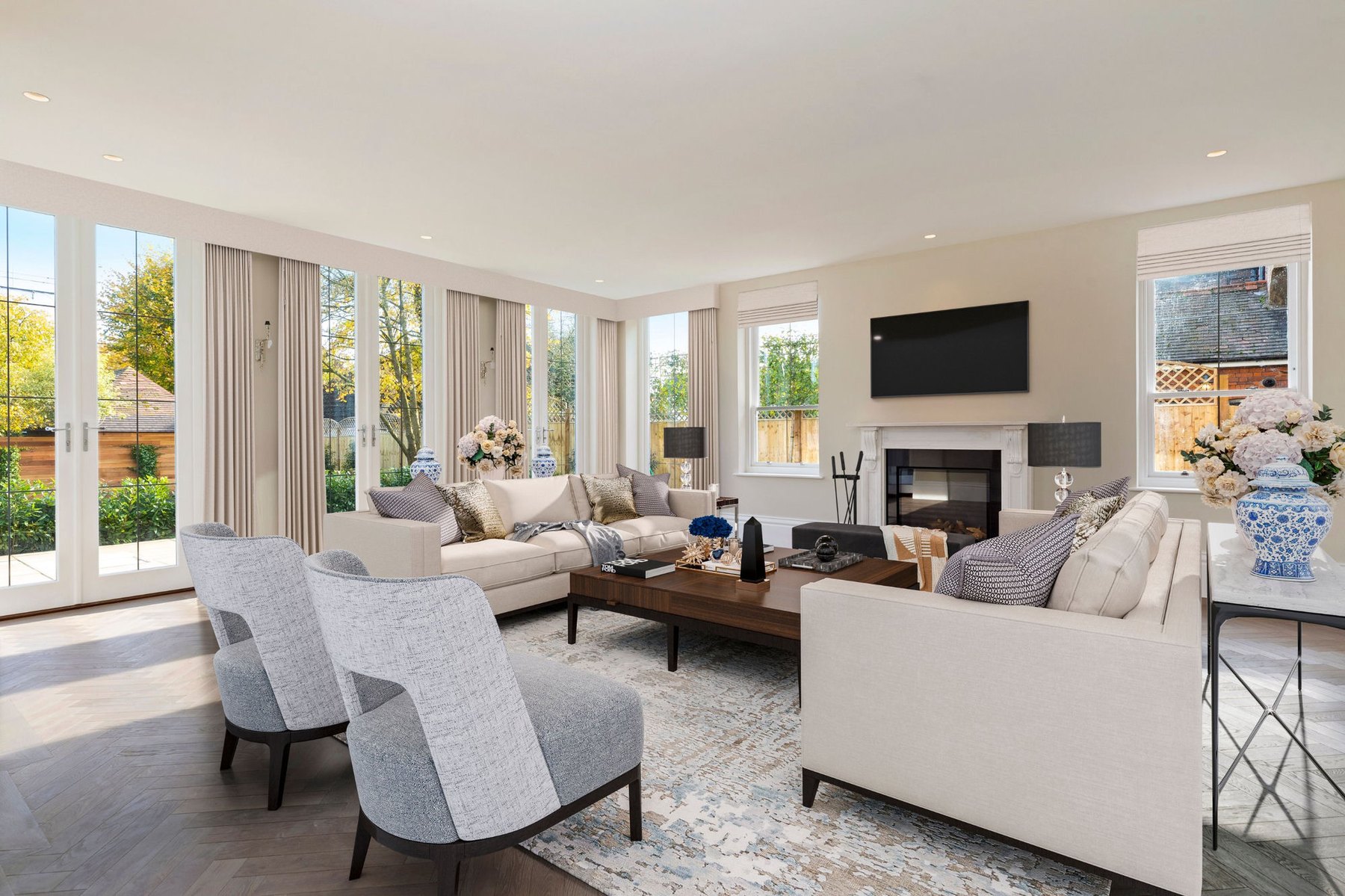 Same period property living room after virtual staging with sofas, coffee table, drapery and decor